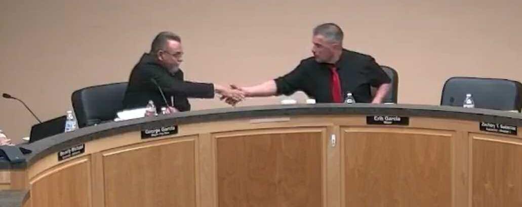 Mayor Erik Garcia (right) and Councilor George Garcia (left) shake hands during the January 15 Grants City Council meeting, signaling a commitment to set aside their differences and move forward for the betterment of the City of Grants. Courtesy Photos