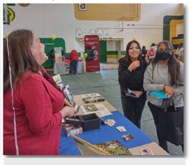 Executive Director Eileen Chavez Yarborough, of the Cibola Communities Economic Development Foundation shares a laugh with Thoreau HS Seniors Monique Joe and Adriana Pahe. Courtesy Photo