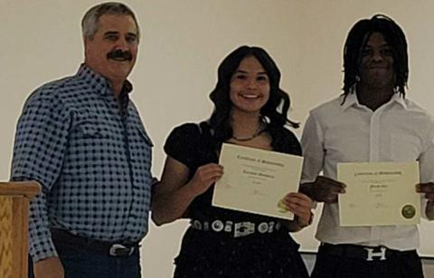 Picture: Left to Right-Mark Head scholarship presenter, recipients Lariahas Desiderio, Uriah Gill Courtesy Photo