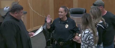 The newly sworn-in Chief of Police Maxine Monte is seen, with her hand on a family bible and surrounded by her family, reciting the oath of her new office. Municipal Judge Michael Cavin administered the oath. Chief Monte made history as the first woman to ever lead Grants Police Department as chief, and laid out a plan to bring crime under control in the city. Courtesy Photo