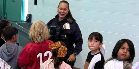 Police Officers Join Local Students for Halloween Fun