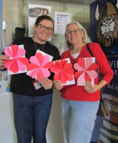 Kayla Brownfield (Vice Principle, on left) from Mesa View Elementary presenting Valentine cards created by their students to Evelyn Siegmann Courtesy Photo