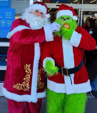 Outside Walmart, as excited students arrived for the Shop With a Cop event, Santa Claus and the Grinch set aside their differences for a jolly photo—reminding everyone that even the grumpiest of hearts can grow three sizes during the season of giving. Mikayla Smith - CC