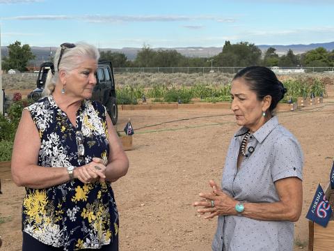 Grants Community Pantry Executive Director Alice Perez speaks with Deb Haaland during a tour of the pantry’s Community Garden Friday, Aug. 21. Perez discussed food insecurity in the region and told Haaland that people from across the economic spectrum can find themselves needing assistance when circumstances suddenly change.