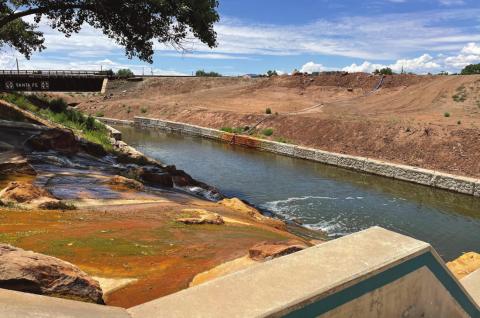 Water flows from a hot spring fountain into a section of the Rio San Jose recently cleaned up by the City of Grants. Kylie Garcia - CC