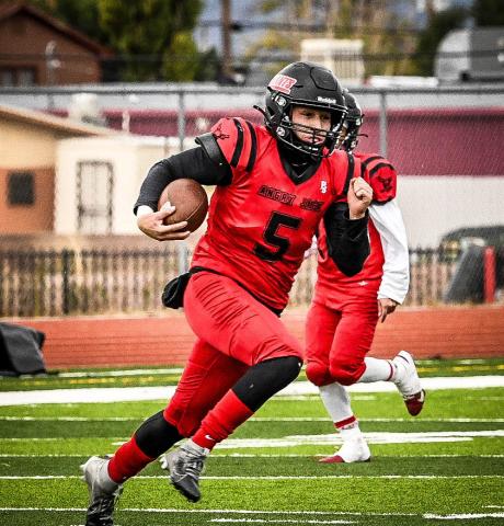 Tristin Fernandez on the quarterback keeper in an earlier football game this past season. Fernandez reflected on his 2024 season as the Pirates quarterback. Franklin Romero - CC