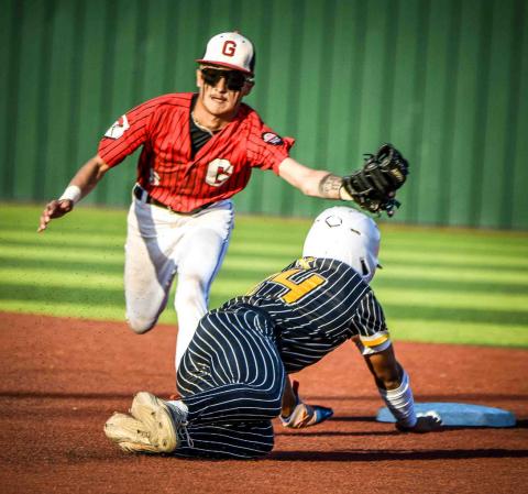 Second baseman Estevan Barela with an out against St. Pius last week in the Nusenda 4A state baseball playoffs. Despite a rally in the 7th inning the Pirates lost in this quarter final game by 1 run for a 3rd time to St. Pius, 3-2. Franklin Romero - CC