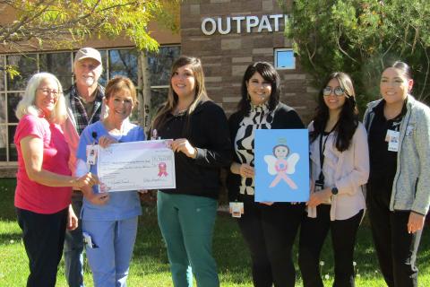 Roger and Evelyn Siegmann present $1,760 check to Cibola General Hospital staff Courtesy Photo
