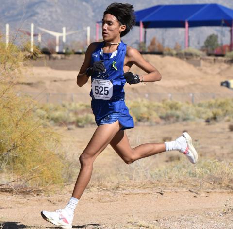 With the Sandia Mountains as a background, Lucas Williams, a junior at Laguna-Acoma High School is this year's 2A cross country champion. Williams blazed across the fast course at Academy High School with a time of 16:18.91. Franklin Romero - CC