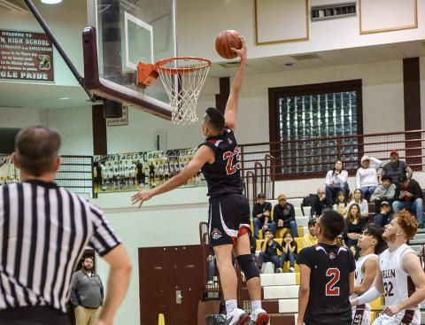 Dunk Time! Senior Isaiah Hernandez, 23, with a big dunk this past Tuesday against district rival the Belen Eagles. Despite Hernandez's dunk and a spirited fourth quarter effort the Pirates fell to the Eagles 61-43 in the first round of their district tournament and were eliminated. The Pirates finished the season 9-15, 2-6 and will lose nine seniors. Franklin Romero - CC