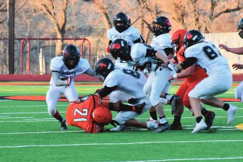 Pirate defense swarming the Bengal offense this past Friday in an away game for the Pirates. The Pirates (2-0) handily defeated the Bengals 51-0. Franklin Romero. - CC