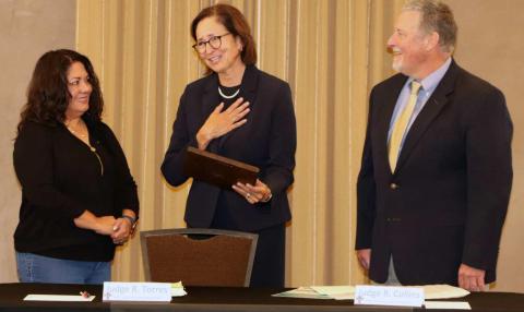 Retired Supreme Court Justice Barbara Vigil, (center) currently the secretary of the Children, Youth and Families Department, receives an engraved award plaque in recognition of her nearly two decades of work on behalf of the New Mexico Tribal-State Judicial Consortium. The award was presented by Consortium co-chairs Bernalillo County Metropolitan Court Judge Renee Torres (left) and Acoma Pueblo Tribal Court Judge Randolph Collins (right). Courtesy Photo