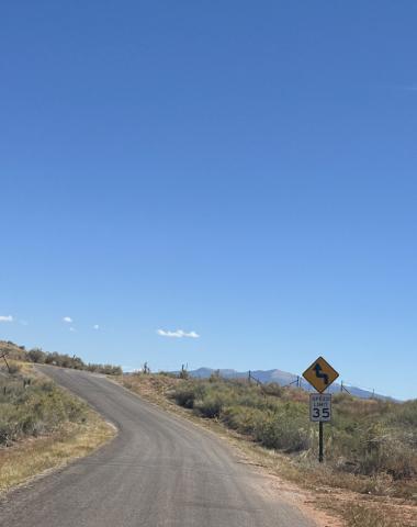 September 2024, Mount Taylor peaking past the horizon up cemetery road in Bluewater. Diego Lopez - CC