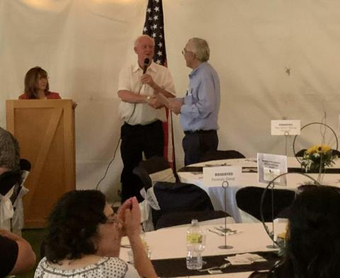 Vice President of the New Mexico Mining Museum Board of Directors Terry Fletcher presented Jon Indall with a plaque to honor his work in the mining industry. Diego Lopez - CC