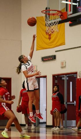 In this file photo Promise Garcia,13, with the photo finish for a bucket. The Lady Pirates are 11-9, 0-2 and are currently ranked 13th in 4A girls’ basketball. They will play Highland at home on January 27th and Belen away on February 2nd in district action. Franklin Romero - CC