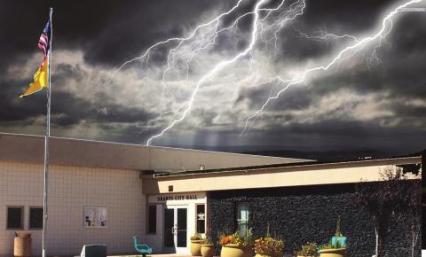 A dark cloud hangs over Grants City Hall and the Council Chambers following the councils recent decision to termintate the city managers contract. Photo illustration by Scott Ford - CC