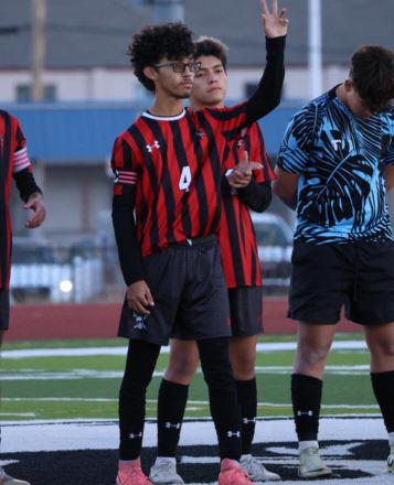 Carlos Fernandez (4) waves during Grants High School Boys' Soccer Senior Night. Carlos is a junior but was part of the team celebration for the 12th grade Pirates. Carlos played center back for GHS this season. Written by AJJ – Carlos Fernandez
