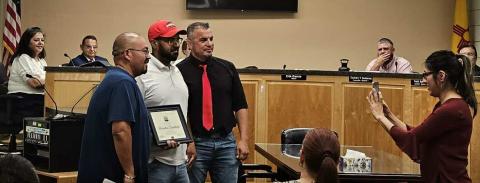 Mayor Erik Garcia presents plaque of recognition to City of Grants Recreation Department. Recreation Director Joaquin Jiron and Recreation Supervisor Andrew Maxwell accept the plaque. Arieanna Crowson CC