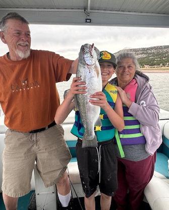 Owen Silva caught a 23-inch Rainbow Trout at Bluewater Lake on May 24, 2025. Standing in the picture with his Tata and Nana. Courtesy Photo