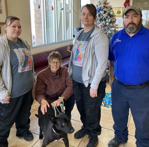 Animal Control Officer Trish Alires (left), volunteer Genette Irsik, Flurry (dog),Animal Control Officer Jennifer McCrackan, and Animal Control Officer Juan Lopez (right). Faith Mosley - CC
