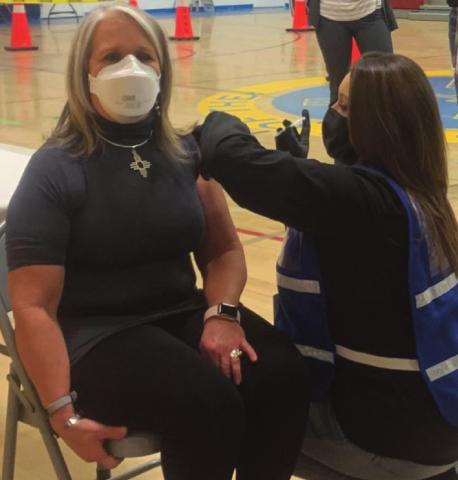 Governor Michelle Lujan Grisham receives her first shot of the Pfizer BioNTech COVID-19 vaccine, saying that even though she is now partially vaccinated, she will continue wearing a mask until it is safe to remove them in public spaces. Courtesy photo