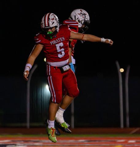 Julian Fernandez, sophomore, celebrates with teammate Elijah Marquez following a Pirates play. Jay Langford- Student Journalist