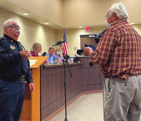Cubero Fire Department Chief Joseph DeSoto (left) presents Doctor Karl Gutierrez with an Outstanding Service Award, an honorary firefighter certificate, other small gifts, and a heartfelt thank you for all of Gutierrez’s work and support of CFD and Cibola County over the years. Kylie Garcia - CC