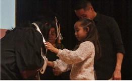 Brianne Chavez was pinned by her daughter Leah Vicente and Henry Vicente.