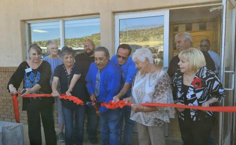 Village of Milan current and former trustees cut the ribbon announcing the grand opening of the new village hall. Arieanna Crowson - CC