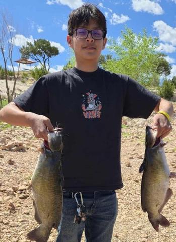 Kai Sandoval battled and caught two catfish using worms on June 7. Courtesy Photo