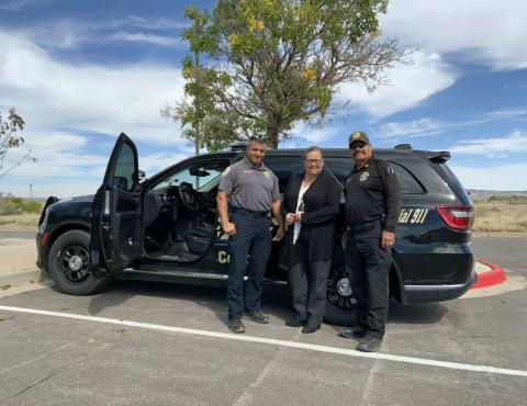 Standing at left, Sheriff Larry Diaz, Cibola County Manager Kate Fletcher, and Undersheriff Jeff Marez stand in front of a recently equipped CCSO cruiser. The truck was outfitted with modern technology that is expected to protect the deputies, create data for the department so they better manage their patrols, and protect the civil liberties of those they arrest. Diego Lopez - CC