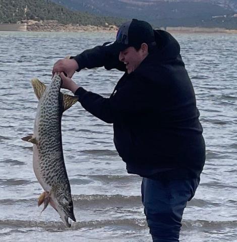 Chance Benton, a teen cancer survivor from Albuquerque, caught seven trout and this tiger muskie using hot dogs and worms on April 3. “He played hooky from work,” Stacey Turpen said. “Beautiful lake, beautiful time and well worth the day off.” Courtesy Photo