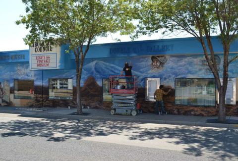 James and Blake Emory working on the Origin images for The Cibola Arts Council on W. Santa Fe Ave. Kathryn Marmon - CC