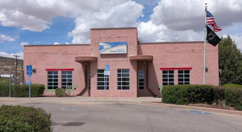 Pictured is the USPS Office on Route 66 in Grants, New Mexico. The post office has long served as the centerpiece of town, with the city once called “Grants Post” before it eventually settled simply with the name, “Grants”. Now, in 2026, the US Postal Service Office is housed down the street from its original location. Earlier this month USPS announced they are seeking to increase the cost of postage. Sylvia Anzures Gonzales - CC